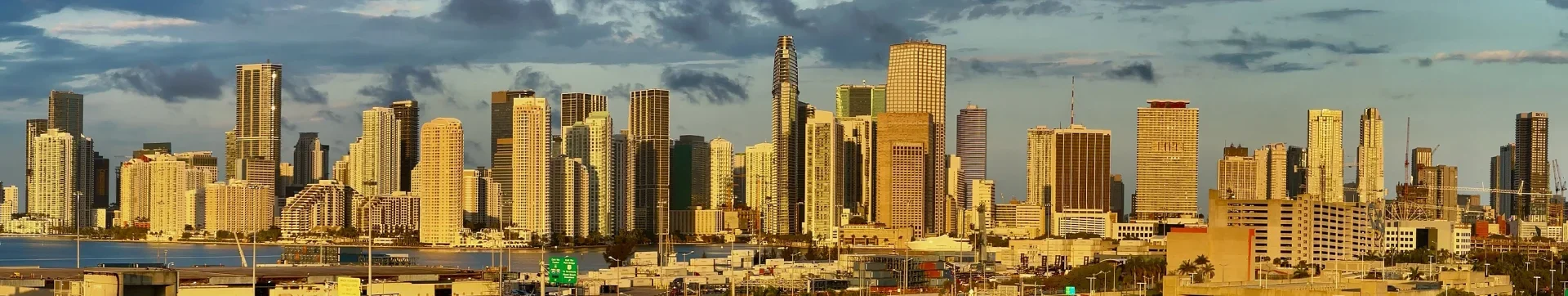 Miami skyline across the water at first light