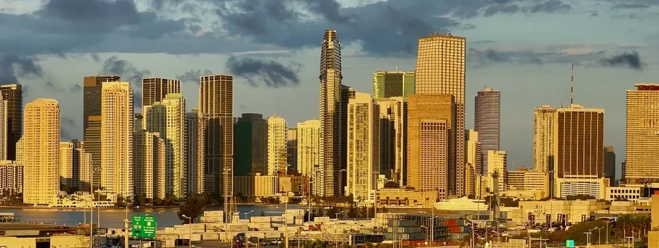 Miami skyline across the water at first light